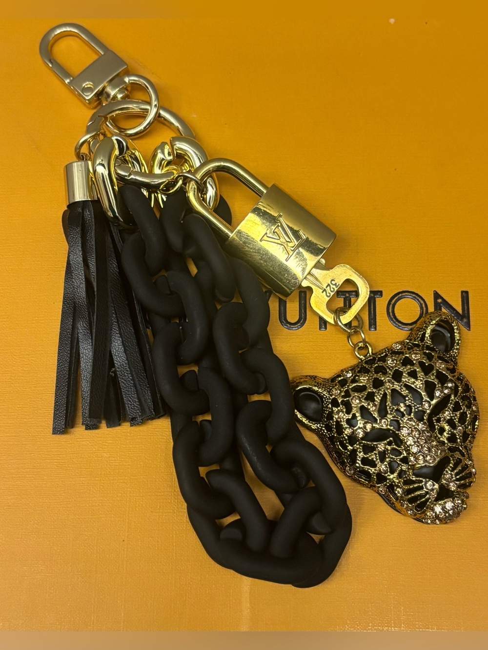 Louis Vuitton Lock & key, black chain & Cheetah head, 7 inches